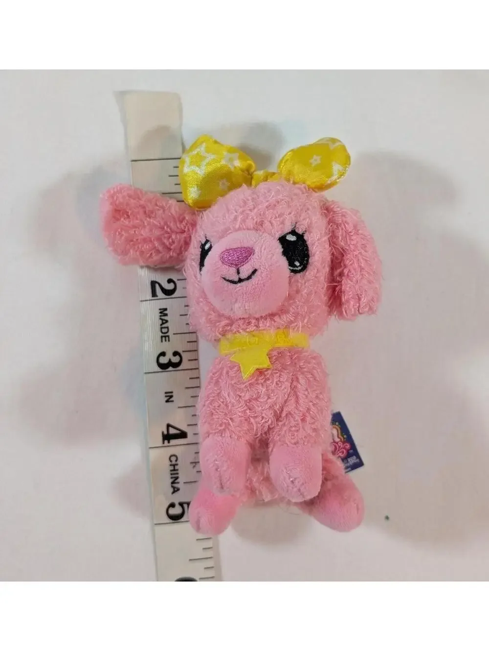 Wish Me by Jay@Play Pink Plush Dog with Yellow Star Collar and Bow